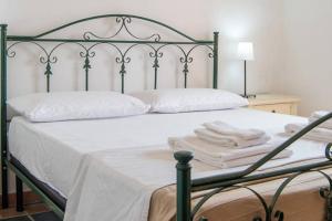 Postel nebo postele na pokoji v ubytování Agriturismo Agrimaccari Marzamemi-Vendicari - Esperienza autentica siciliana