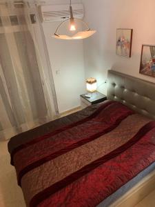 A bed or beds in a room at First Line Cabo Roig Orihuela Costa