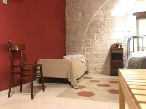 Postel nebo postele na pokoji v ubytování Palazzo Lupicini Affittacamere