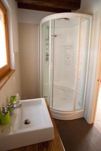 a bathroom with a shower and a white sink at Agriturismo "Antico Borgo" in Marostica