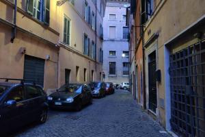 a group of cars parked on a narrow alley at Lanza Tomasi Apartment - centre in Rome