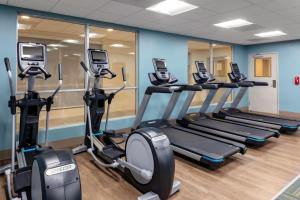 a row of treadmills in a gym at Holiday Inn Express & Suites - Wilmington West - Medical Park, an IHG Hotel in Wilmington