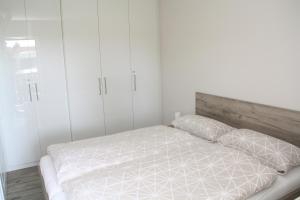 En eller flere senge i et værelse på Apartment am Hütteberg