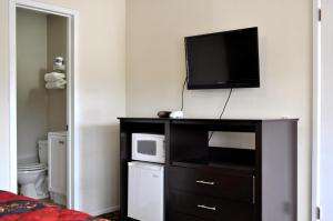 Kuchyň nebo kuchyňský kout v ubytování Andrews Motor Inn
