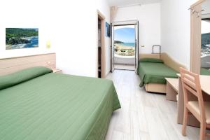 Postel nebo postele na pokoji v ubytování Hotel Incanto