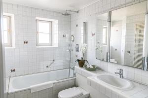 Ванна кімната в Hotel Hirschen am See
