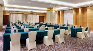 a conference room with blue tables and white chairs at InterContinental Shijiazhuang, an IHG Hotel in Shijiazhuang