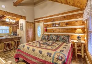 a bedroom in a log cabin with a bed at Puppy Love #1619 in Gatlinburg