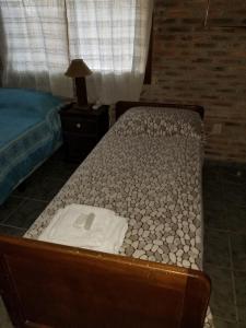 מיטה או מיטות בחדר ב-Hospedaje lo de la Ñata
