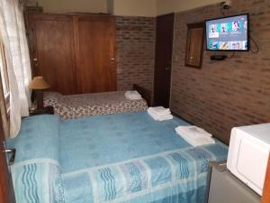 מיטה או מיטות בחדר ב-Hospedaje lo de la Ñata