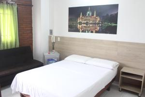 Postel nebo postele na pokoji v ubytování Hotel Elimar
