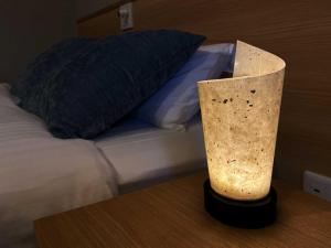 Postel nebo postele na pokoji v ubytování HOTEL CLA-SS HIROSHIMA-OZU