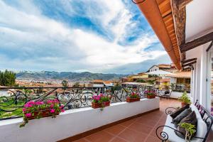 a balcony with a view of a city at Luna House Cusco in Cusco