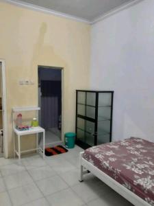 Ένα ή περισσότερα κρεβάτια σε δωμάτιο στο Hostel TARUNA +13 φωτογραφίες