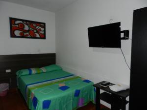 เตียงในห้องที่ Hotel Sucre Del Bosque