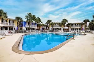 a swimming pool at a resort with condos at Bungalows at Seagrove 135 - MerSea in Seagrove Beach