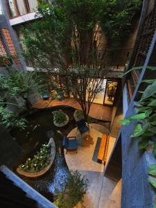 an overhead view of a pond in a building at Minh Boutique in Danang