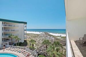 a view of the beach from the balcony of a resort at Dunes of Seagrove Condominiums in Seagrove Beach
