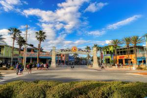 a group of people walking around a street in a city at Sunrise Beach Resort V in Panama City Beach