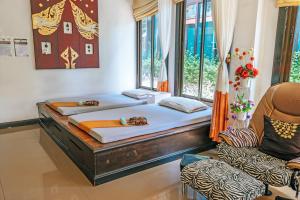 Voodi või voodid majutusasutuse Phi Phi Andaman Legacy Resort toas