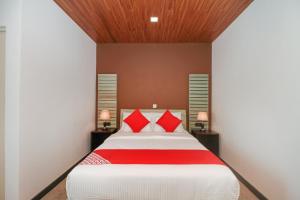 A bed or beds in a room at Hotel 198 Negombo