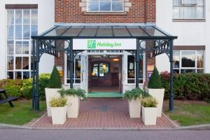 a building with a sign on the front of it at Holiday Inn Ipswich Orwell, an IHG Hotel in Ipswich
