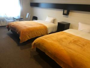 Ліжко або ліжка в номері Green Rich Hotel Hamada Ekimae (Artificial hot spring Futamata Yunohana)