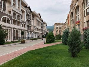 an empty street in a city with buildings at Gorky Gorod Collection in Estosadok