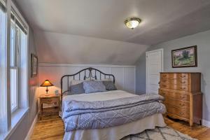 a bedroom with a bed and a dresser and a window at Rapid City Home with Patio by Canyon Lake Park! in Rapid City