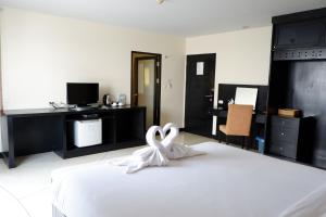 Postel nebo postele na pokoji v ubytování Amarin Samui Hotel - SHA Plus Certified
