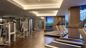 a gym with treadmills and machines in a building at InterContinental Shanghai Hongqiao NECC, an IHG Hotel in Shanghai