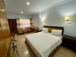 Postel nebo postele na pokoji v ubytování Mariani International Hotel