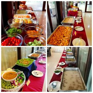 a buffet line with different types of food on it at Nana Buri Hotel in Chumphon