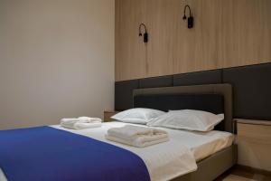Postel nebo postele na pokoji v ubytování Hotel IRIS