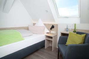 En eller flere senge i et værelse på Hotel Landgasthof Linde