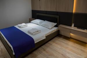 Postel nebo postele na pokoji v ubytování Hotel IRIS
