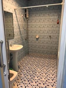 Een badkamer bij M.P Resort