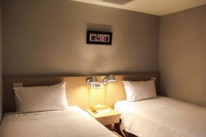 Katil atau katil-katil dalam bilik di Mellow Fields Hotel