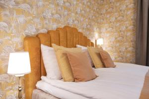 Postel nebo postele na pokoji v ubytování Boutique Hotel Yöpuu