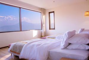 Llit o llits en una habitació de Hotel Annapurna View Sarangkot