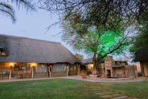 a large building with a green light on top of it at Tshukudiba Game Lodge in Tom Burke