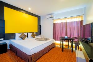 Voodi või voodid majutusasutuse Phi Phi Andaman Legacy Resort toas
