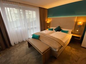 เตียงในห้องที่ Appartementhotel Cura Bad Füssing