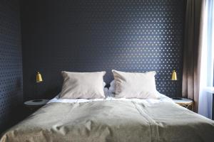 Postel nebo postele na pokoji v ubytování Boutique Hotel Yöpuu