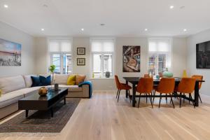 a living room with a couch and a table at Keyser Apartments 6 in Bergen