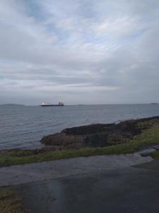 a large container ship in the ocean with at The Plaza Suites High St Bangor in Bangor