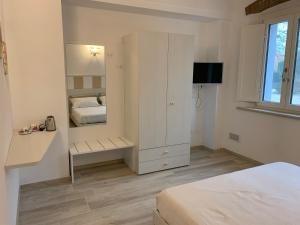 Postel nebo postele na pokoji v ubytování B&B Nonna Teresa