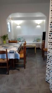 a room with two beds and a table and chairs at les tilleuls in Léon