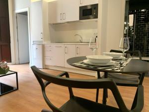 Kuchyň nebo kuchyňský kout v ubytování Ritual Sevilla Suites Centro