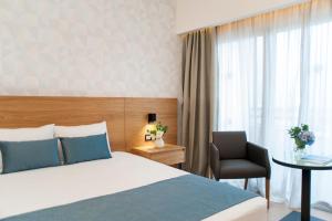 Кровать или кровати в номере Ajax Hotel